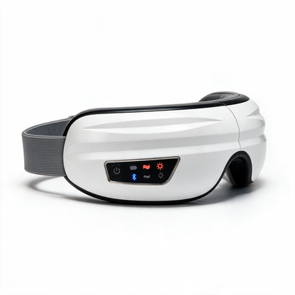 The white Nove Body Heated Eye Massager at a three-quarter angle, its heat, massage and Bluetooth lights on