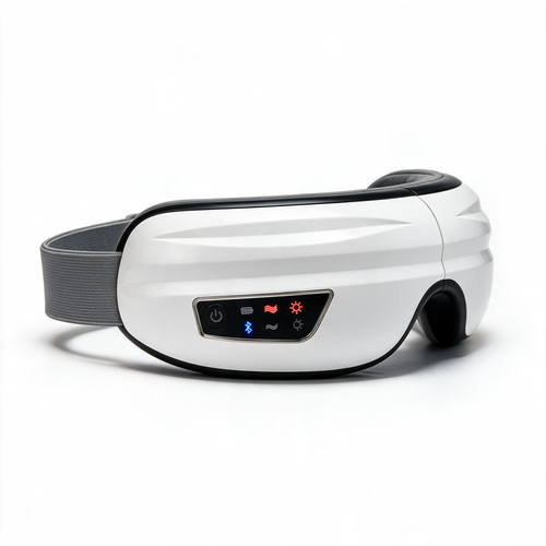 The white Nove Body Heated Eye Massager at a three-quarter angle, its heat, massage and Bluetooth lights on